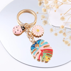 Porte-clés Coccinelle Coccinelle Pastel et Feuille Arc-en-Ciel