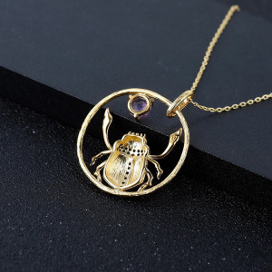 "Sun Dance" Scarab Necklace | Gold Circle & Purple Crystal