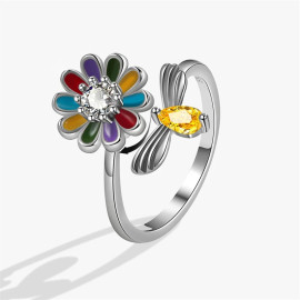 vue détaillée de l'abeille qui butine une fleur colorée  bague tournante anti-stre
