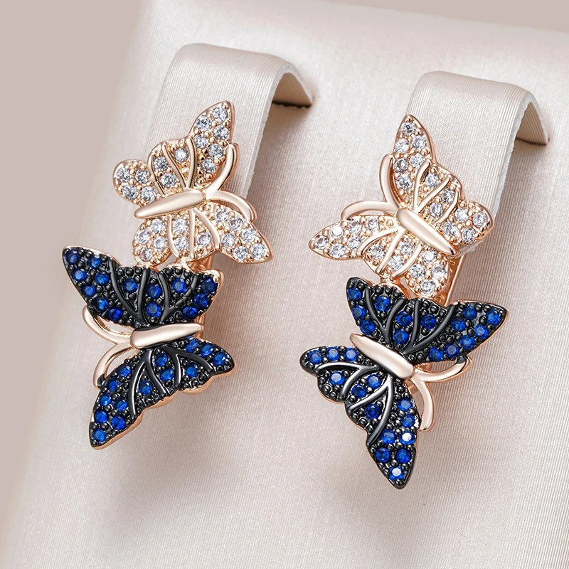 Boucles d'Oreilles Papillon Strass Bleus et Argent – Élégance et Luxe