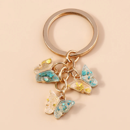 Porte-clés papillon en résine transparente avec paillettes - Couleur Multicolore
