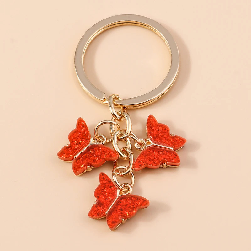Porte-clés papillon en résine colorée avec paillettes - couleur Rouge