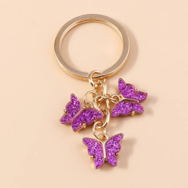 Porte-clés papillon en résine colorée avec paillettes - couleur Violet