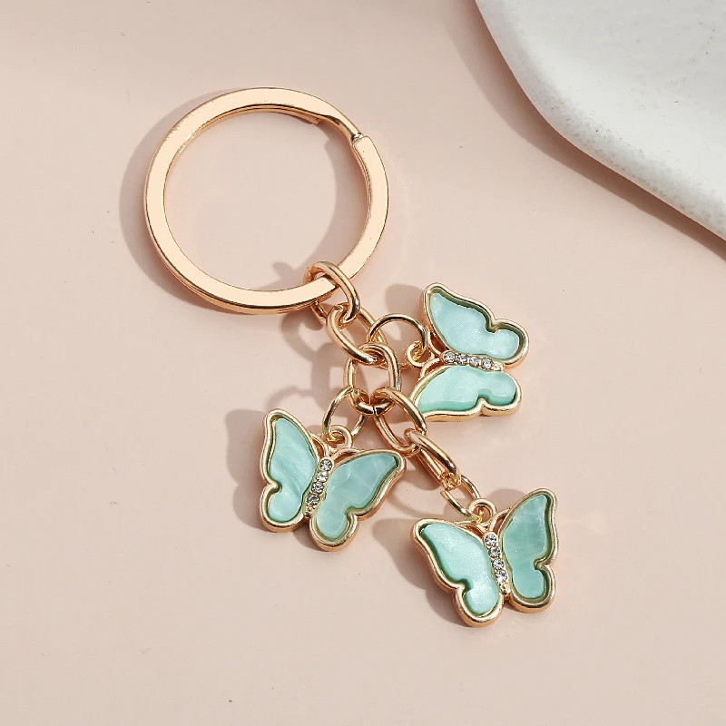 Porte-clés papillon en résine et strass - couleur vert