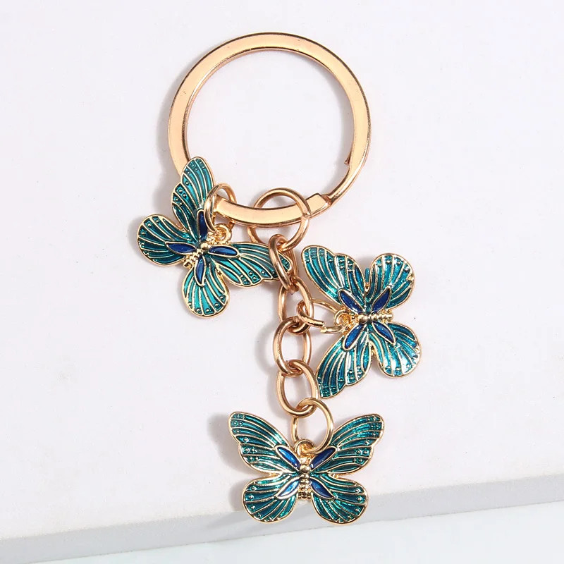 Porte-clés papillon en émail plaqué or - couleur bleu