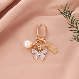 Porte-clés papillon en strass avec perle - modèle 4