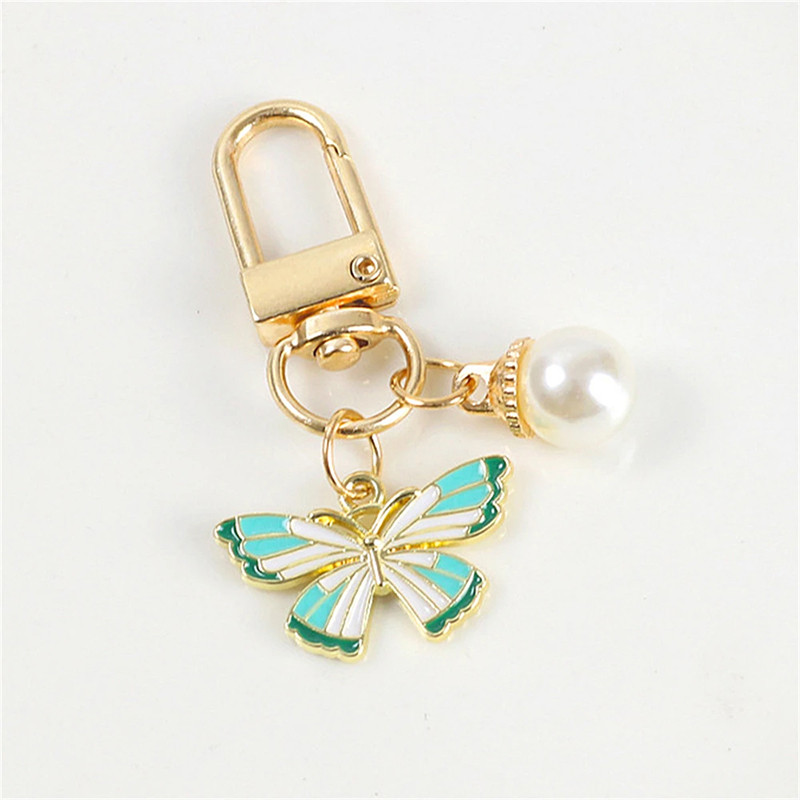 Porte-clés papillon aux couleurs vives avec perle Blanche - modèle 2
